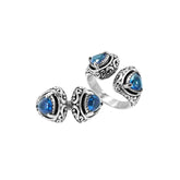 Sterling silver Bali scrollwork ring with trillion-cut Blue Topaz Quartz – artisan handcrafted statement jewelry for women.
